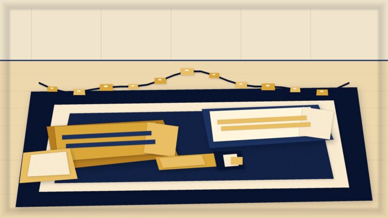Cut paper illustration of sleeping bags and a torch on a living room floor with fairy lights
